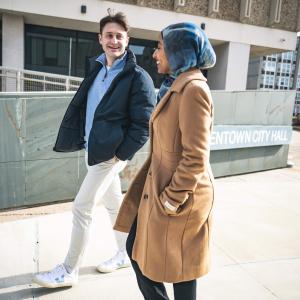 Trevor Tormann walking with Huda Hagos in Allentown. 