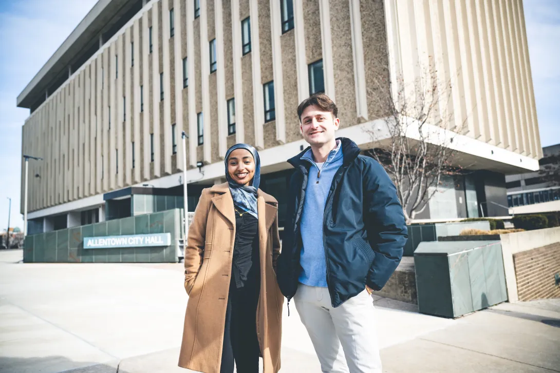 Trevor Tormann and Huda Hagos standing together outside Allentown City Hall.