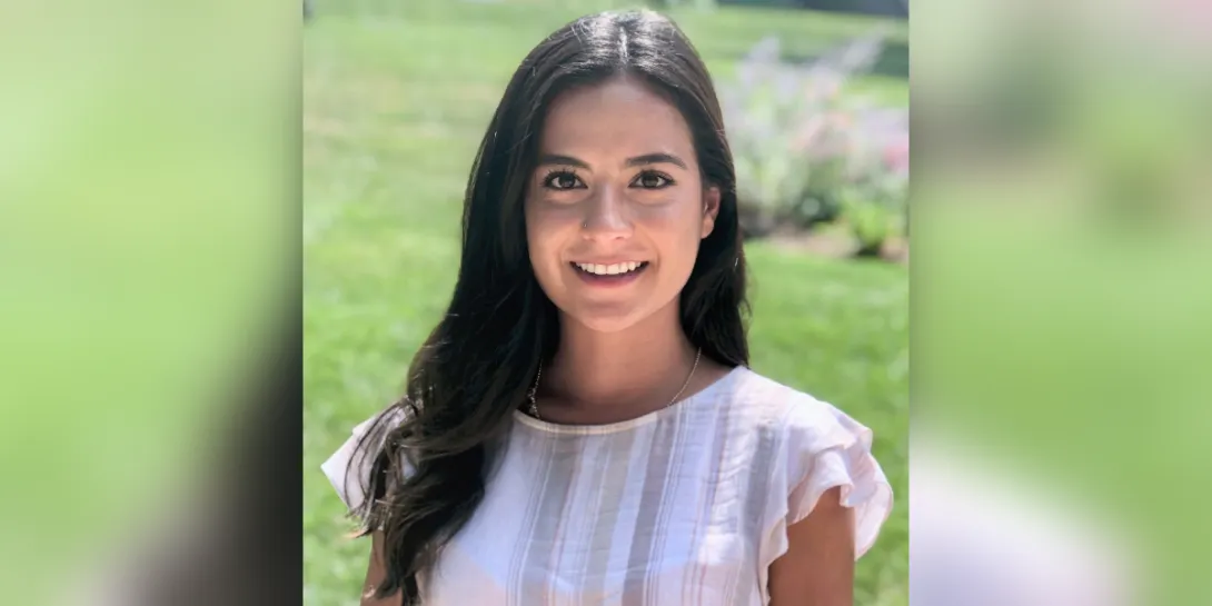 Marilyn Perez-Mendoza smiling for her portrait outside.